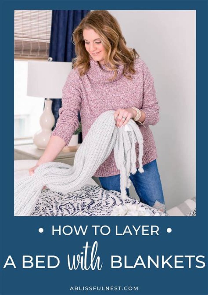 How do you layer an electric blanket on a bed?